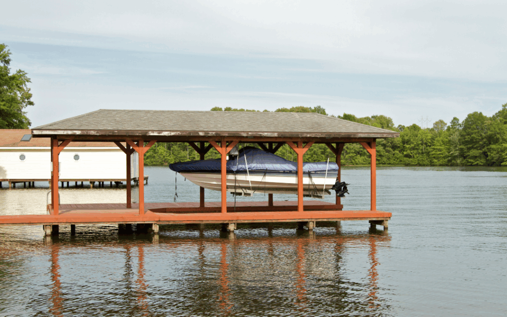 Boat in covered boat hoist in a boat dock