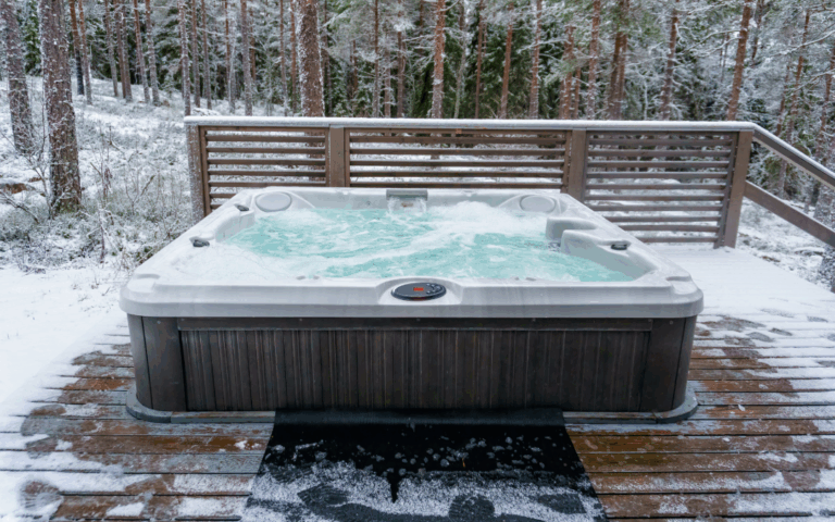 hot tub on a deck overlooking wooded area