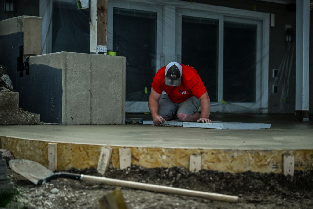 Midwest Concrete crew finishing a fresh stamped concrete pour.