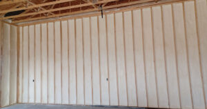 Spray foam insulation applied in an attic to fix a hot upstairs.