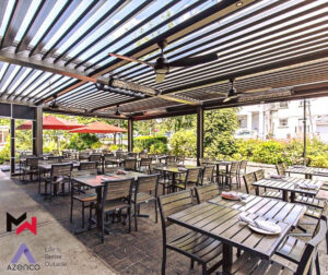 Azenco louvered pergola shading a backyard patio in northwest Iowa.